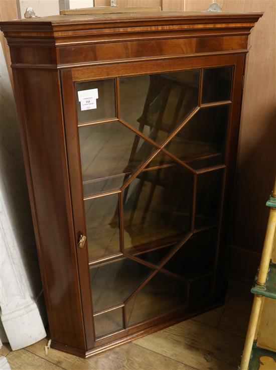 A mahogany hanging corner cabinet, W.2ft 7in.